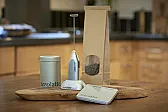 steaming milk |  I can't tell what the gizmo does.  That looks like a heating elementon the...